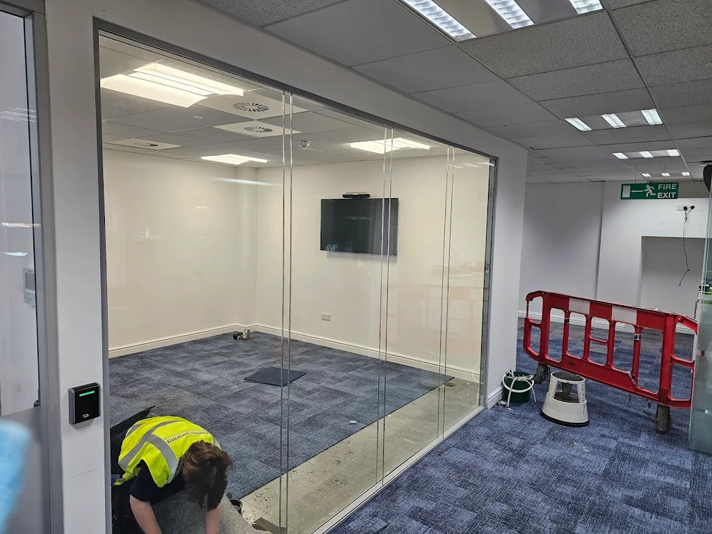 Sealing and alignment work on a glass door to improve energy efficiency